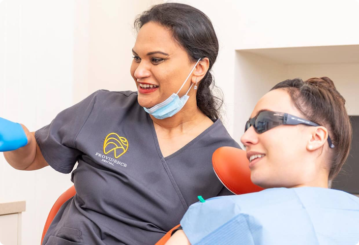 Providence Dental clinician sharing a warm moment with a patient